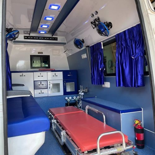 SSR ambulance patient bay set up for monitored transport, with stretcher, LED lighting and safety equipment